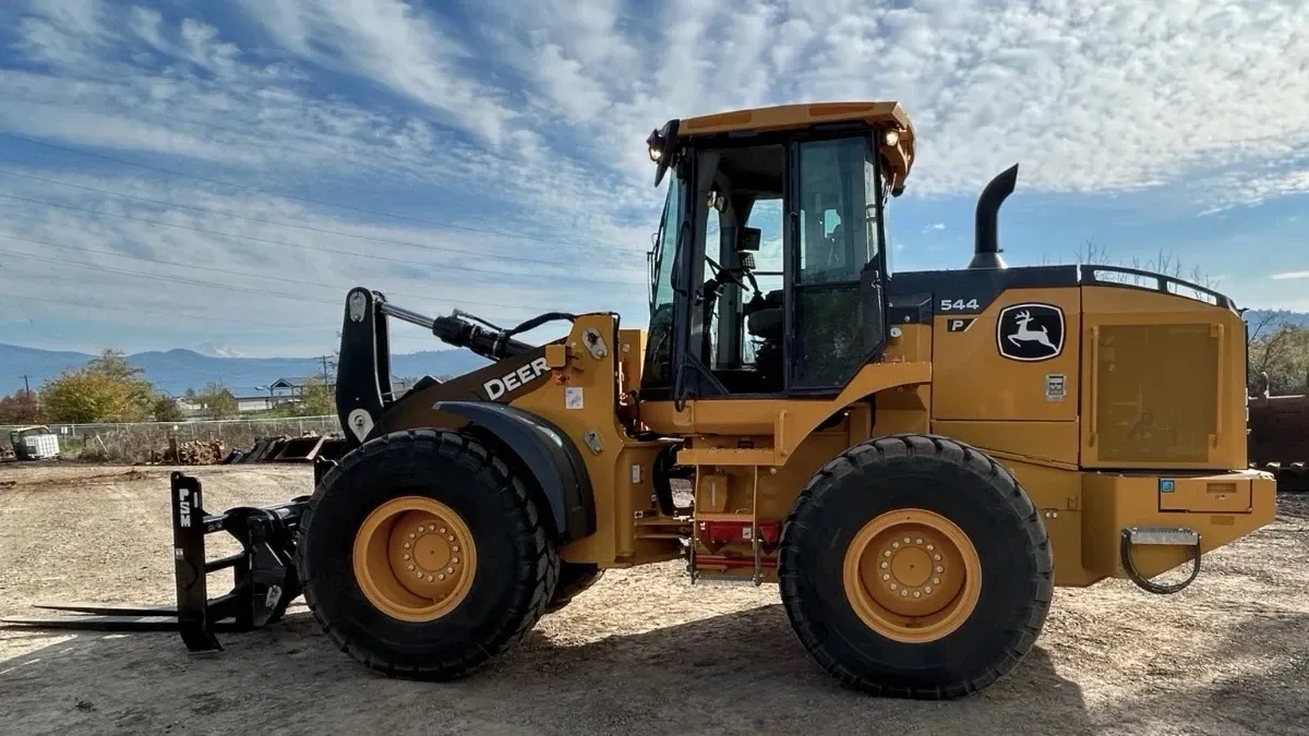 Wheel loader used for loading, moving, and stockpiling material